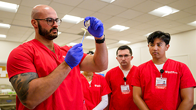Four nursing students in a simulation lab.
